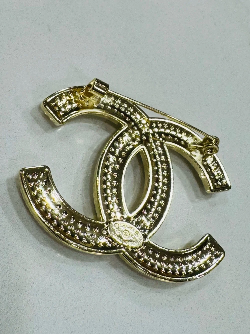 CHANEL Gold Pearl CC Logo Brooch on Navy Silk
